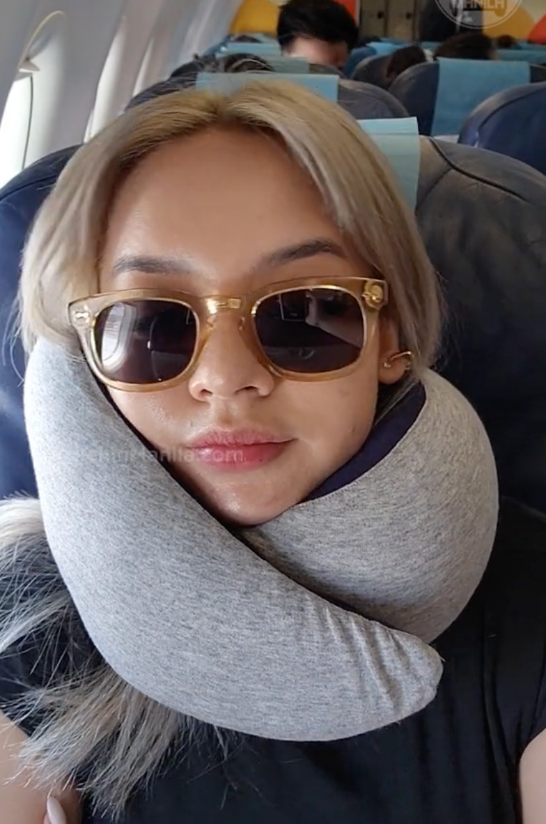 Ostrich Go Neck Pillow wrapped around neck during airplane seat test